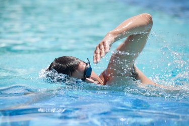 Young man swimming in a pool