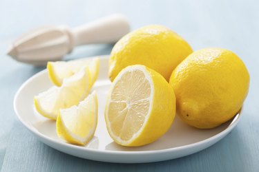 fresh lemon sliced over blue