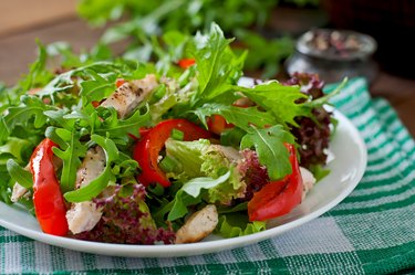 Dietary salad with chicken, arugula and sweet red pepper