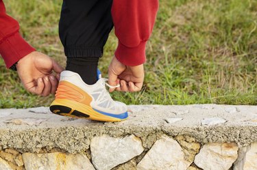 Man Tying Jogging Shoes