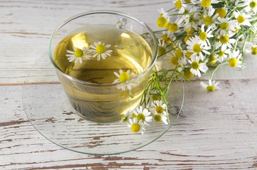 cup of chamomile tea with flowers