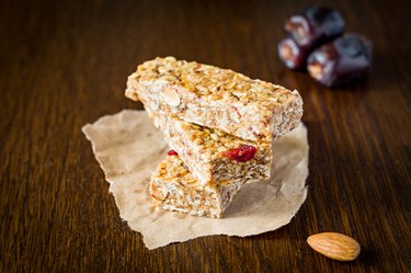 Granola bars or energy bars on brown background