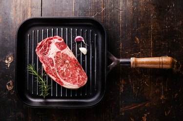 Raw Steak ribeye on grill pan
