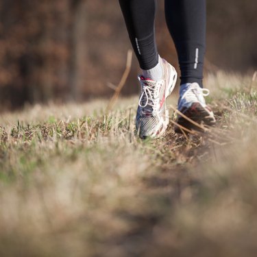 Young woman running outdoors in a city park