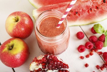 Fresh organic red smoothie with apple, watermelon, pomegranate,