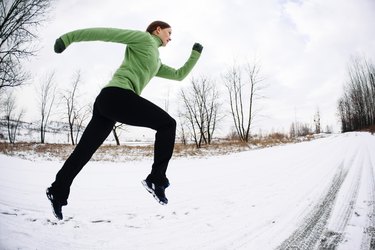 Woman training running in winter