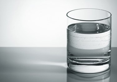 Grey water glass with bubbles