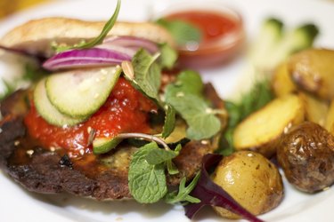 Delicious vegan burger on white plate