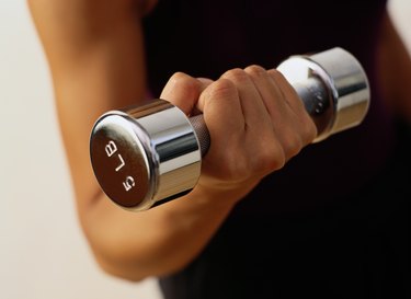 Close-up of a Woman Lifting a Dumbbell