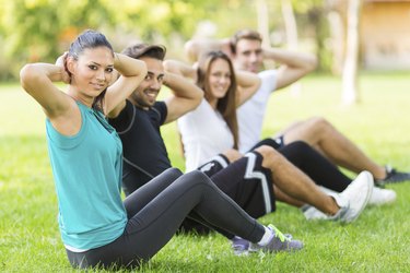 Group of people exercising in park