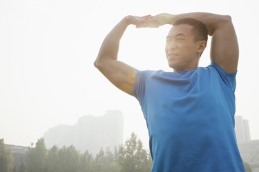 Young Muscular Man Stretching