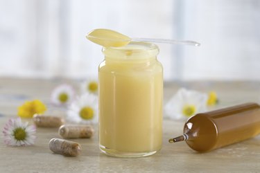 raw organic royal jelly in a small bottle