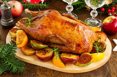 Festive Christmas duck baked with apples and figs.