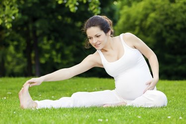 Pregnant woman practicing in the park