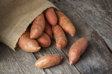 Sweet Potatoes Spilling From Burlap Bag