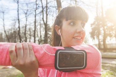 Young Woman Doing Arms and Shoulders Stretching Exercises.