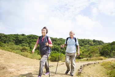 asian senior couple hiking