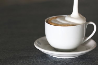 Cappuccino cup on a gray background