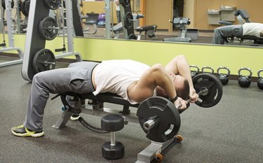 Man Doing E-Z Curl Bar Skullcrusher