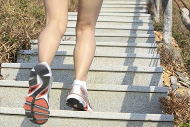 woman running up on mountain stairs