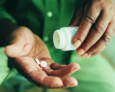 Close-up of Pills Being Held in Someone's Hands