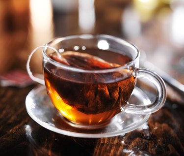 hot cup of tea steeping in glass