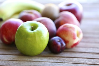 Juicy fruits on wooden table, close-up