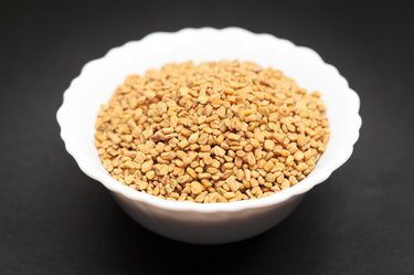 Organic Fenugreek in white bowl