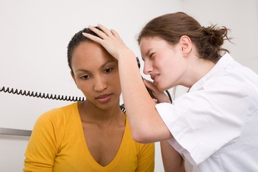 Checking her ear