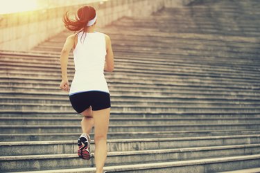 Runner athlete running on stairs.