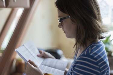 Young woman reading official letter