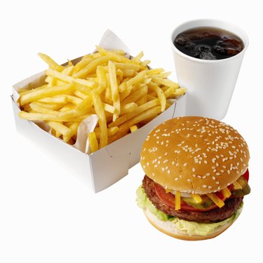 Close-up of burger and french-fries with cold drink