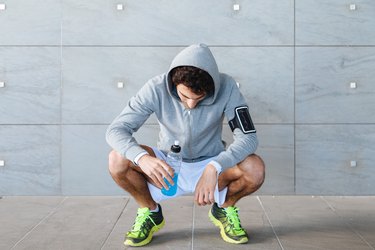 Young man resting on a run