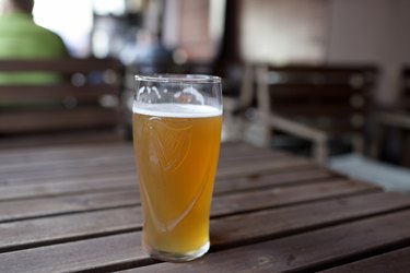 Glass of beer on table