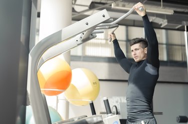 Young handsome man working out in a  gym