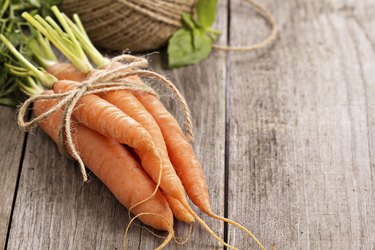 Fresh carrot with green leaves