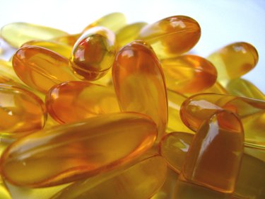 A close-up of fish oil tablets that contain omega-3 fatty acids