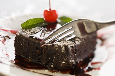 fork on a slice of chocolate cake