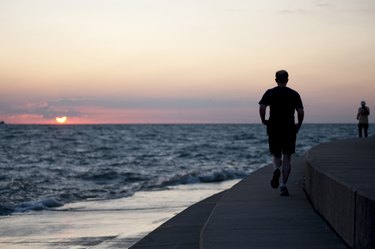 Jogger running along Lake Michigan, Chicago, Illinois