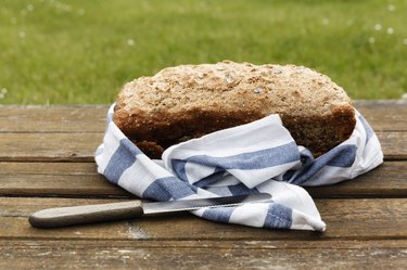 Wholemeal wheat spelt bread on wooden table