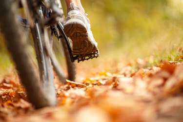 foot on pedal of bicycle