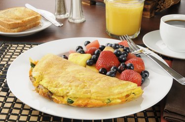 Breakfast omelet wiht fruit and berries