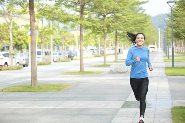 sports asian woman jogging