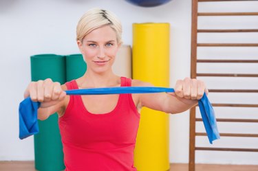 Blonde woman stretching arms
