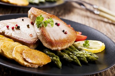 Grilled tuna steak served on asparagus with roasted zmieniakami