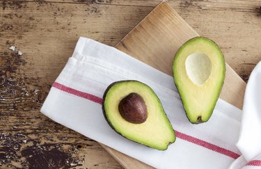 Avocado on rustic wooden background