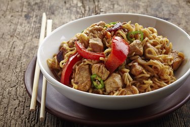 bowl of noodles with chicken and vegetables