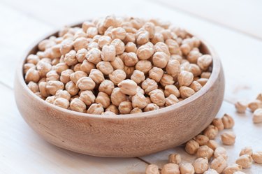 chick-pea on white wooden background