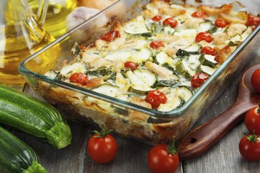 Zucchini baked i with chicken, cherry tomatoes and herbs