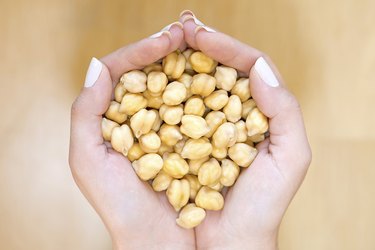 Chickpeas in woman hands